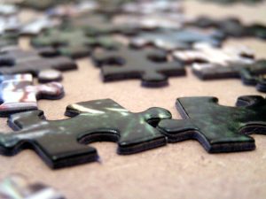 Local Firms Drive Merger Shift